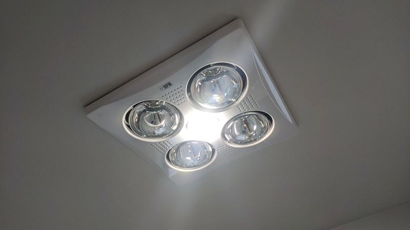 Bathroom heat lamp and light fitting in the ceiling