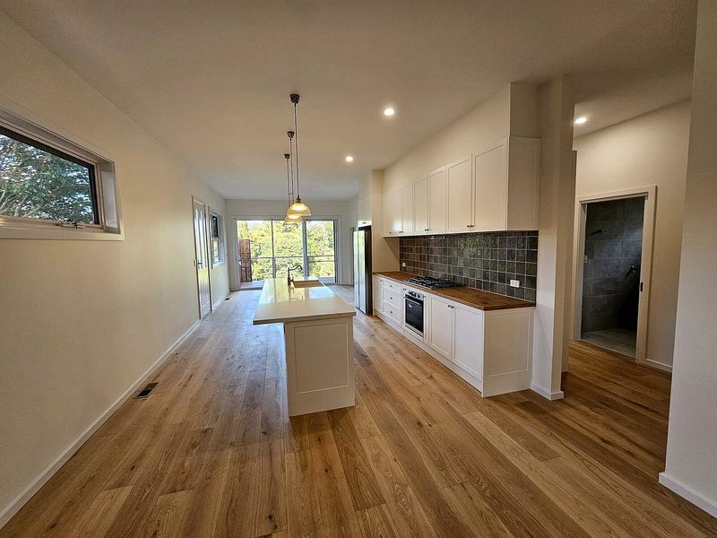 Kitchen with pendant lights and ceiling downlights